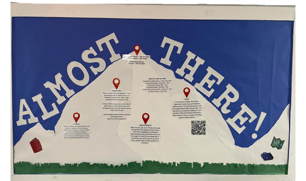 A mountain themed bulletin board to give residents information before "Peak Week"
