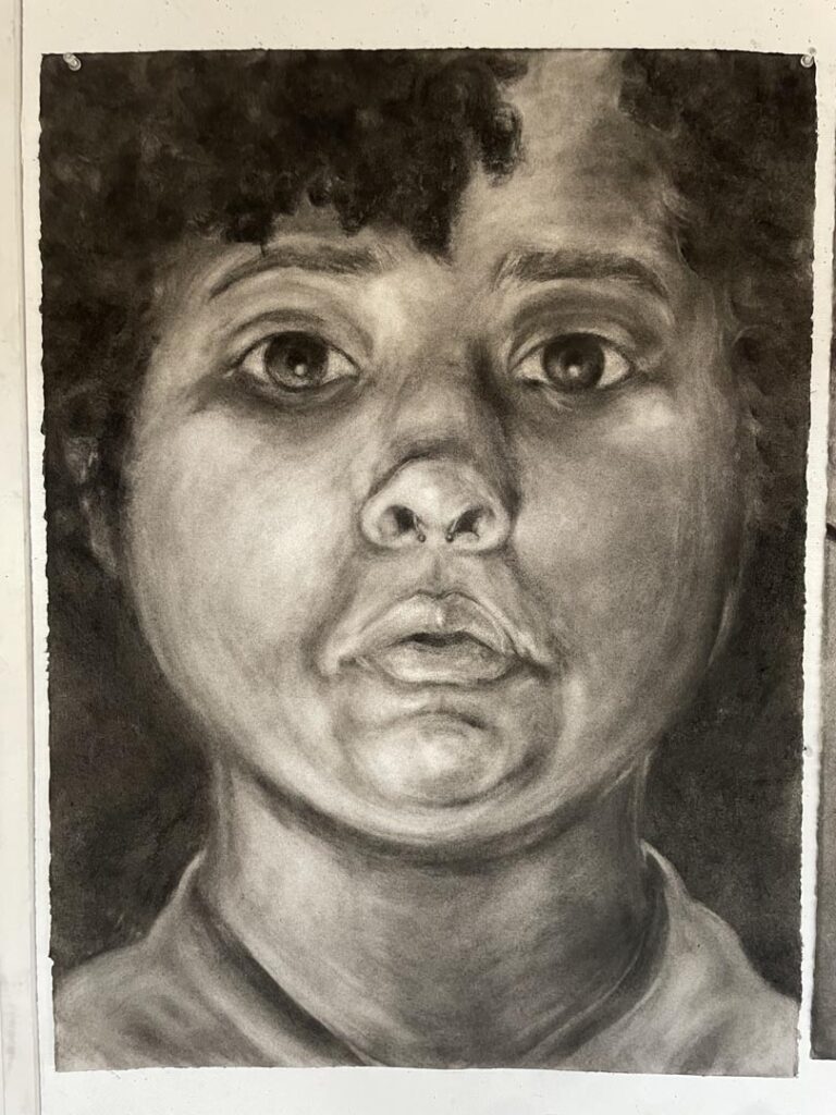 Made with charcoal and an erasure. Could only look at a mirror and no lines!
